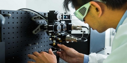Dr Steve Lee works on a laser microscope system. Image Stuart Hay, ANU