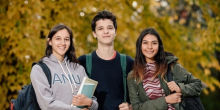 Three students standing together